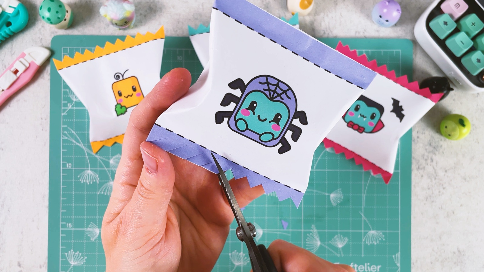 Cutting a zigzag edge into the purple band at the bottom of the bag with scissors