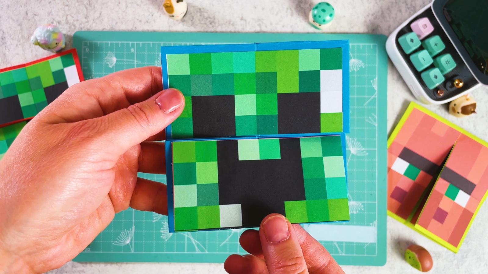 The Creeper face glued on the next side, cut across the middle
