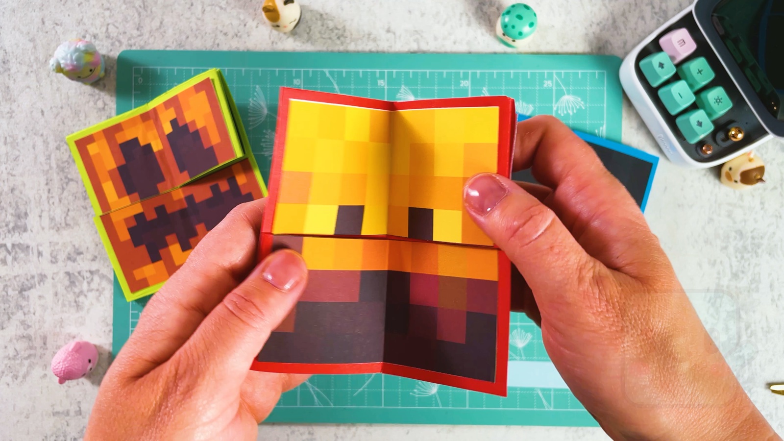 Opening a red-edged flip toy in the middle to show the Blaze face