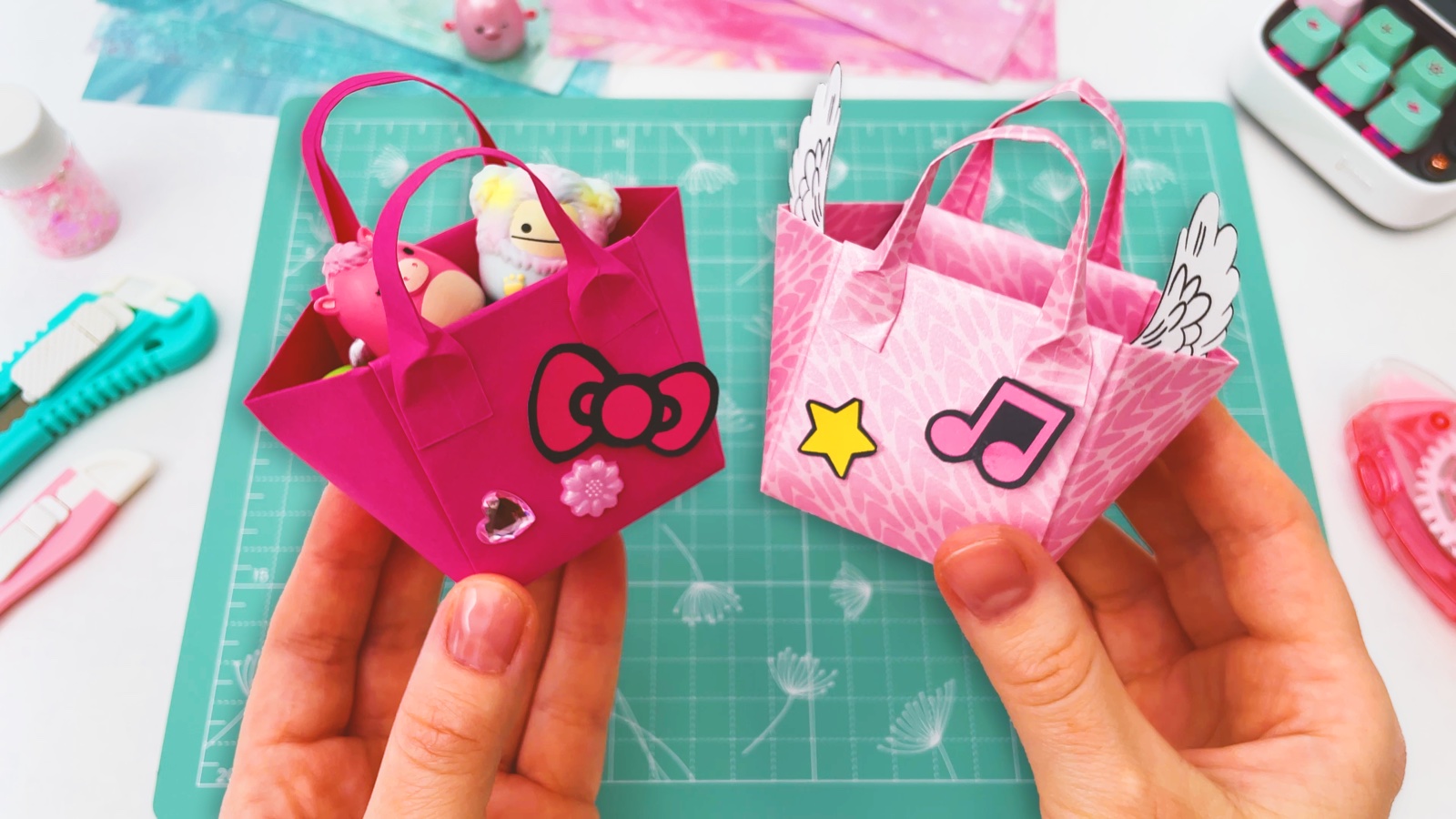 Two finished mini paper shopper bags decorated with stickers