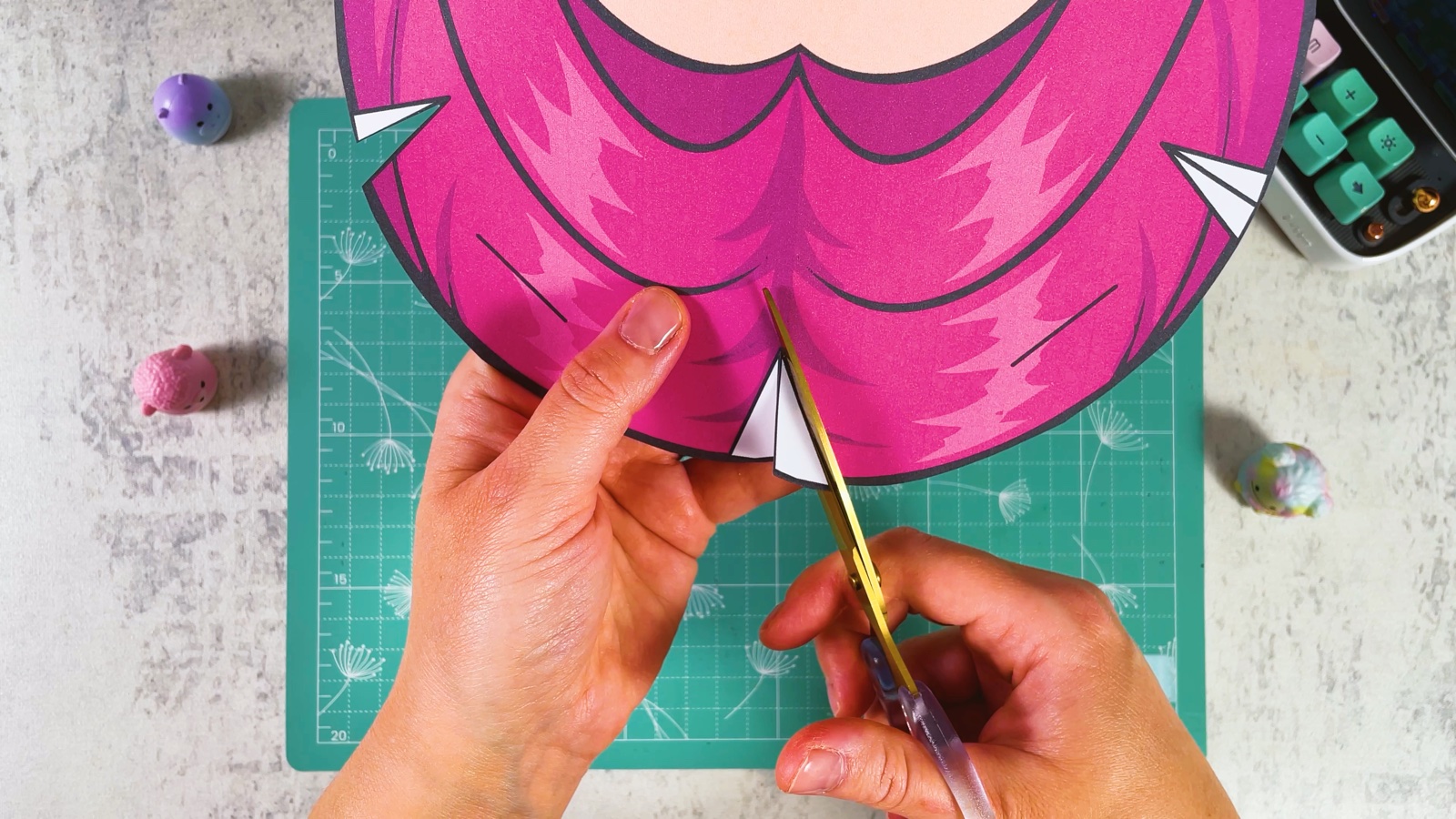 Cutting along the line of the white triangle at the top of the mask
