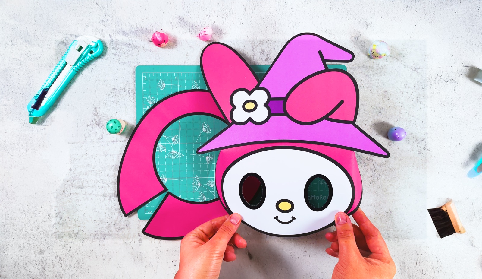 Finished paper My Melody mask with a witch hat and a pink collar