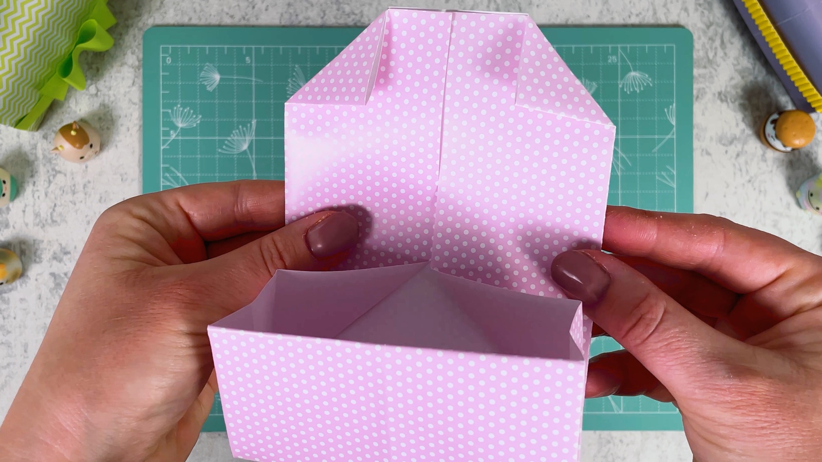 The flap with both top corners folded down into small triangles