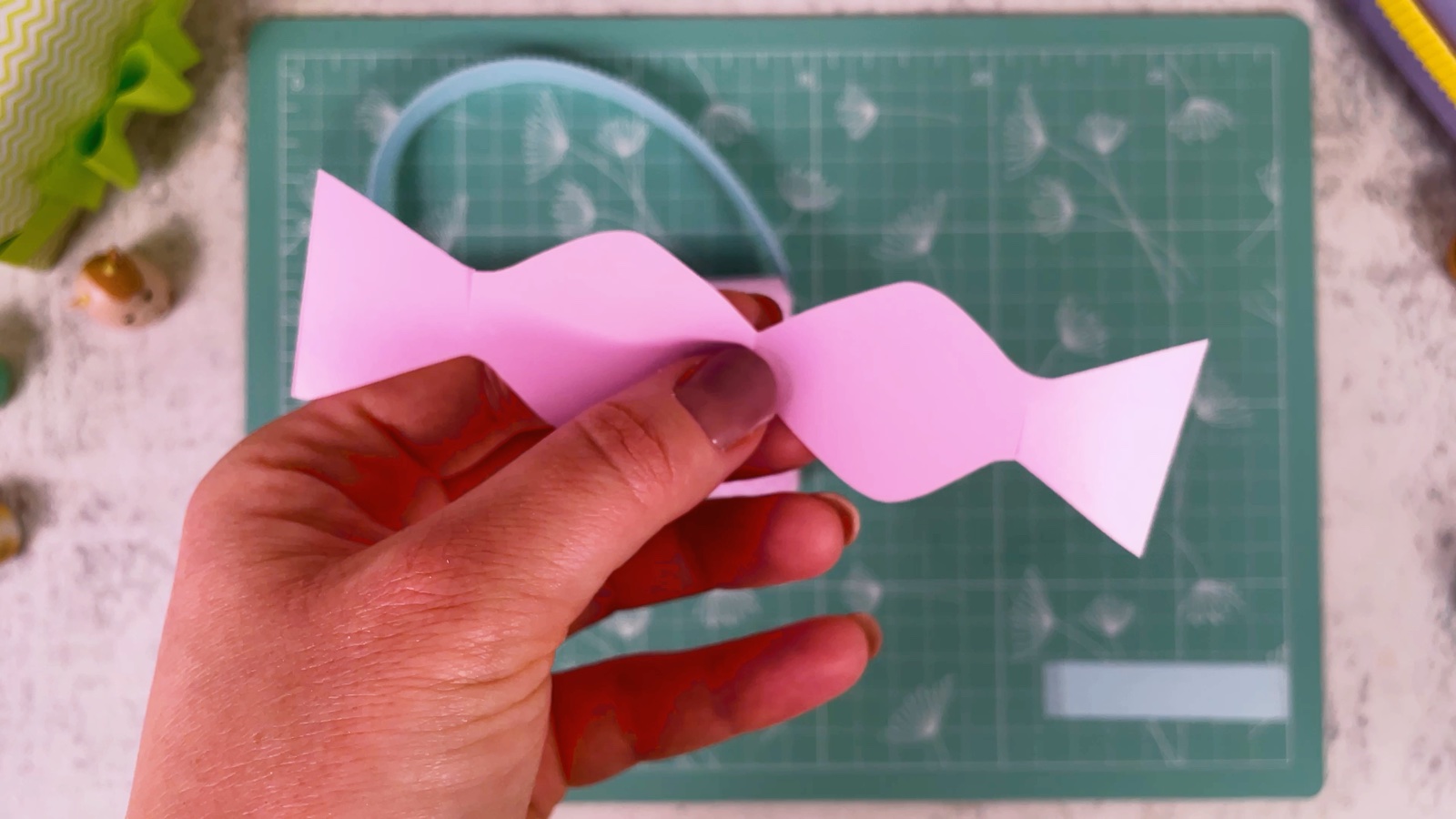 The opened pink bow shape, wide at both ends and narrow in the middle