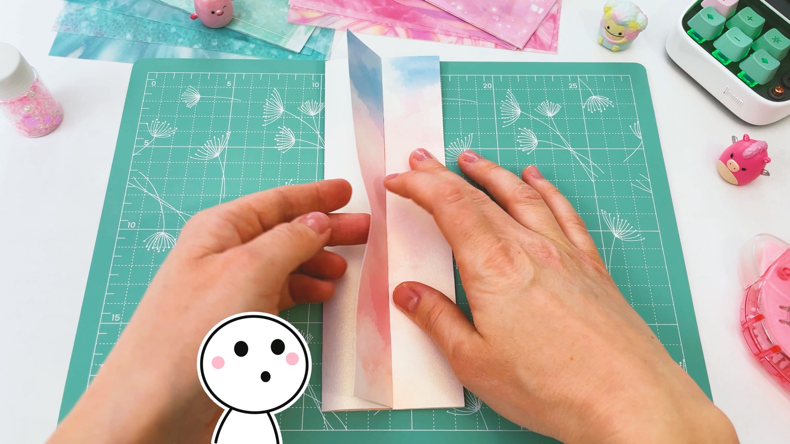 Folding one long side of the paper in towards the middle