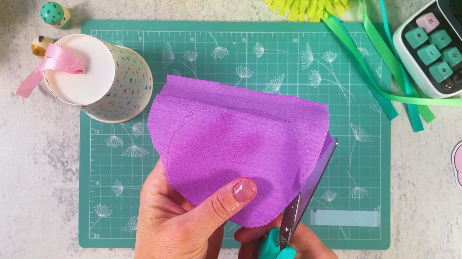 Cutting a circle out of purple crepe paper