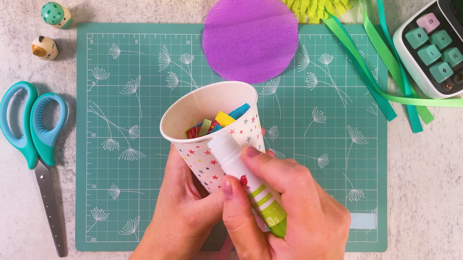 Running a glue stick around the rim of the filled cup