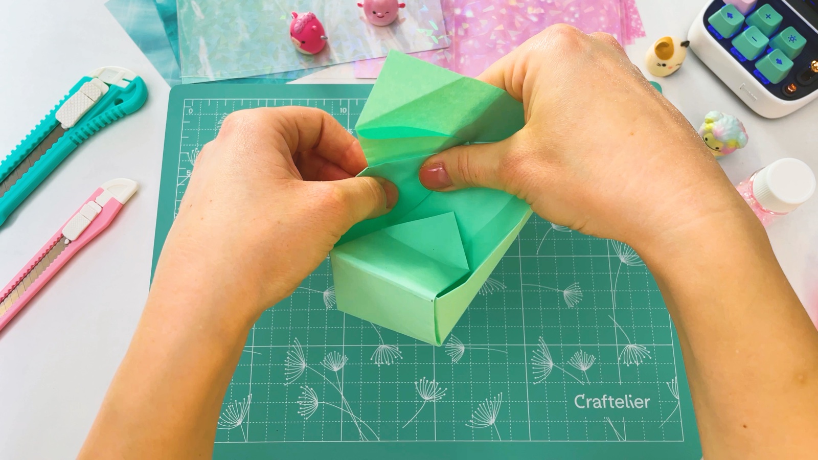 Pushing in the sides of the second end of the box, with one end already finished