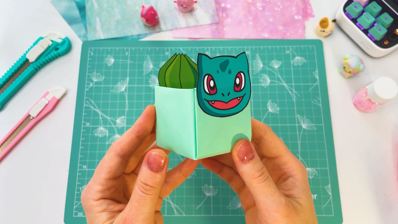 The Bulbasaur box from the front, with the face on the front wall and the green leaf bulb rising behind it
