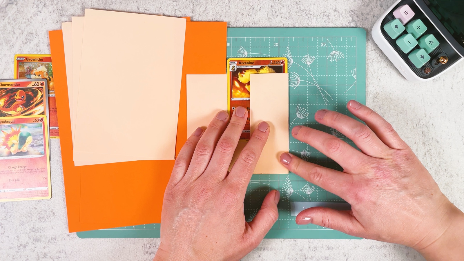 Folding the right side of the paper over the card