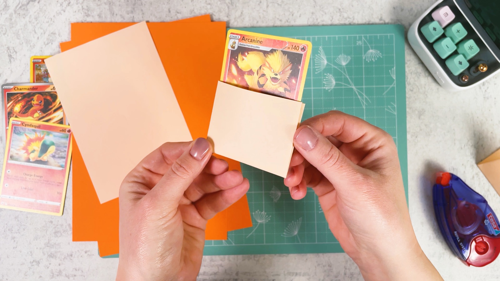 A Pokémon card standing in the finished pocket, with its picture showing