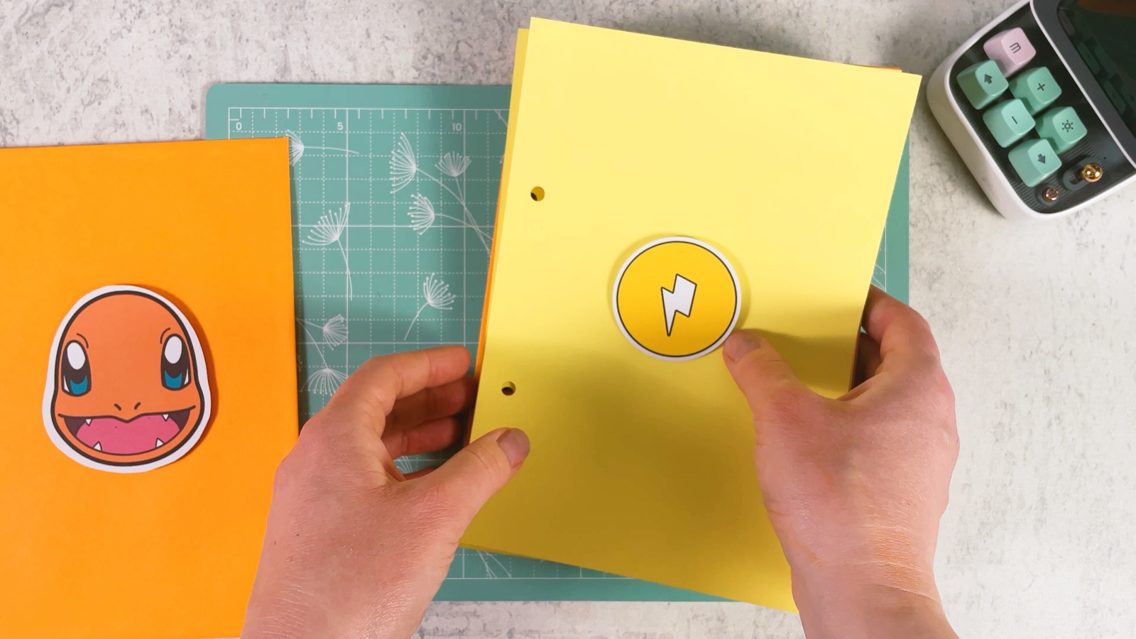 Laying the yellow Electric divider page into the stack of pages