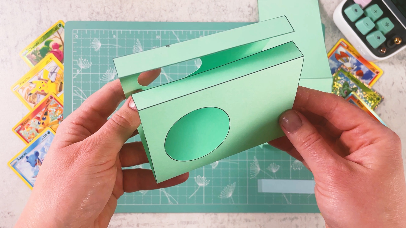 The mint side piece folded into a U shape, with a round hole in each side