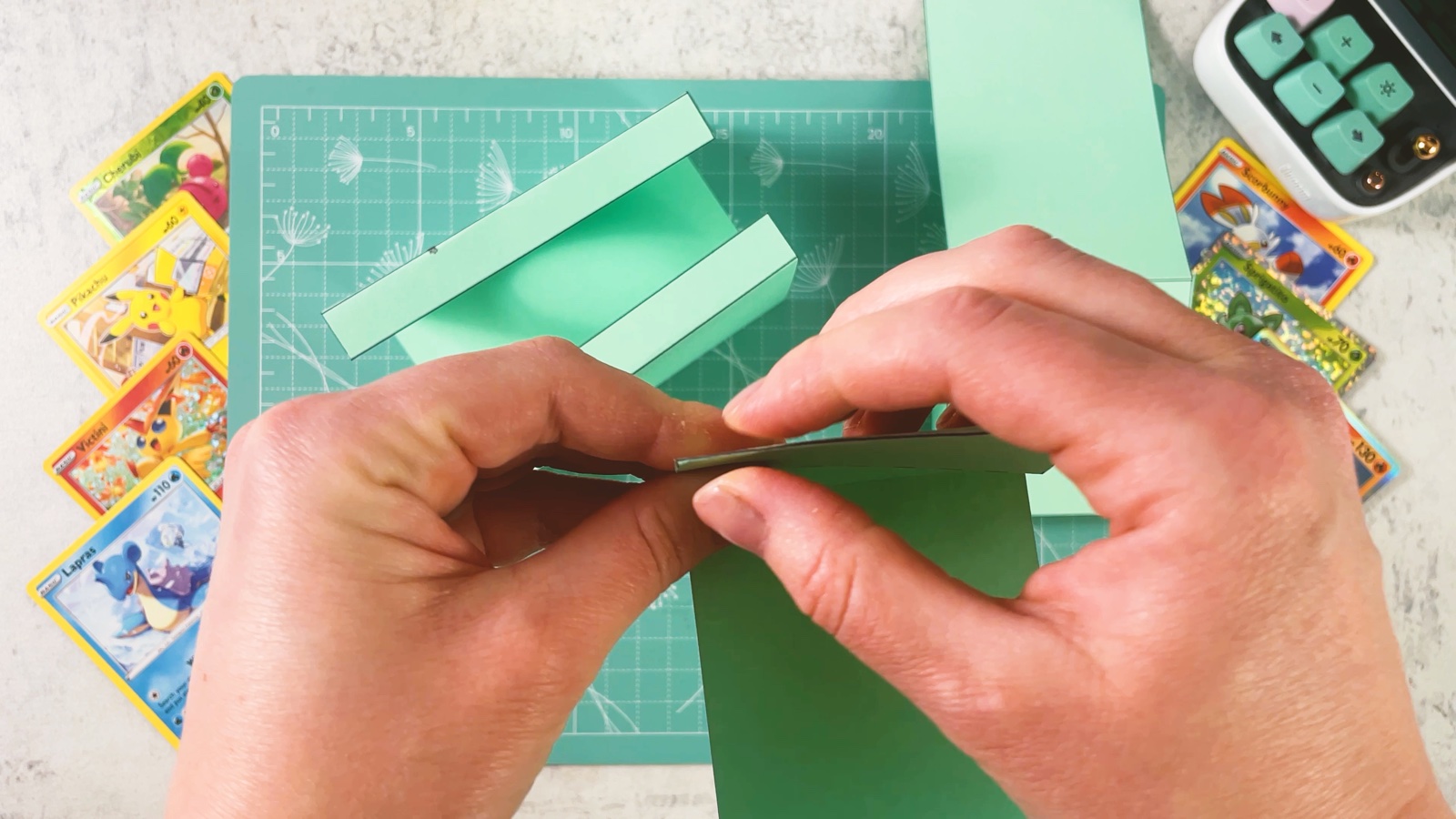 Folding the card tray piece along a line