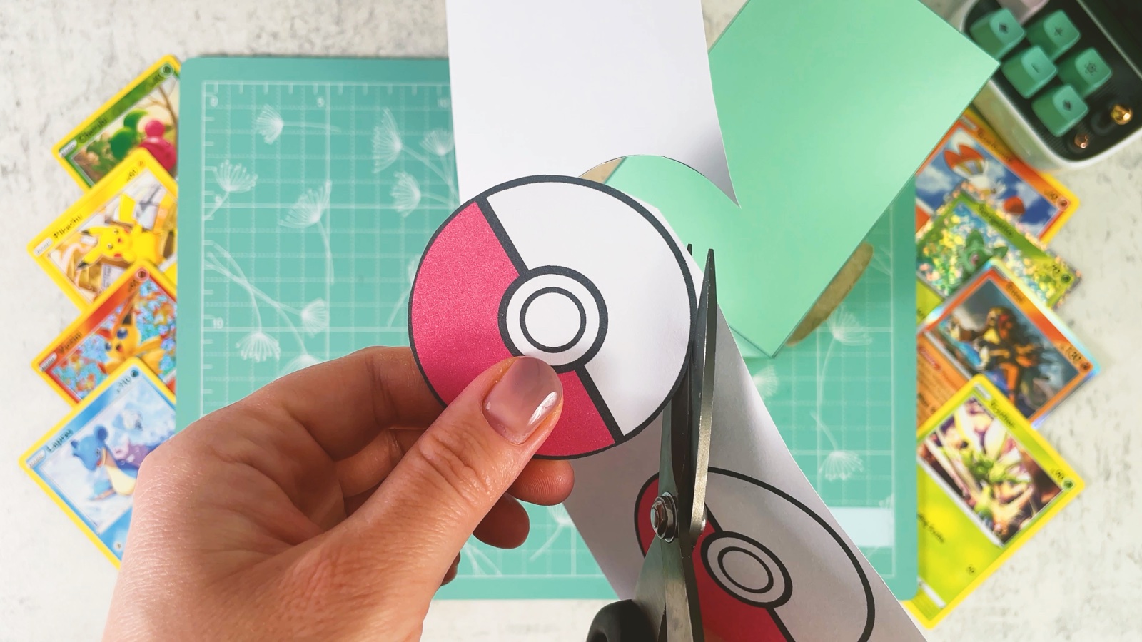 Cutting out a printed Poké Ball circle