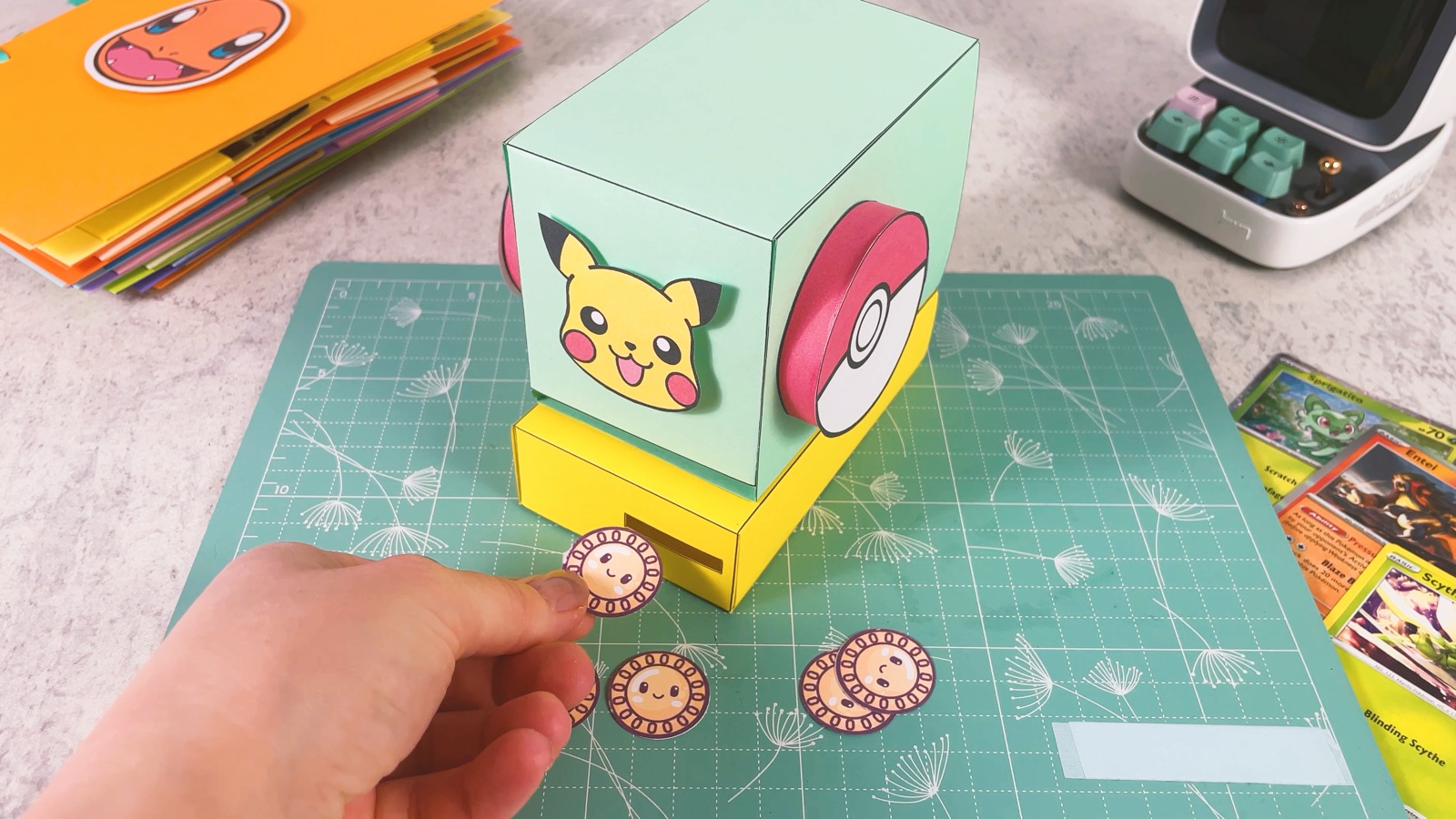 Dropping a paper coin into the coin slot of the yellow base