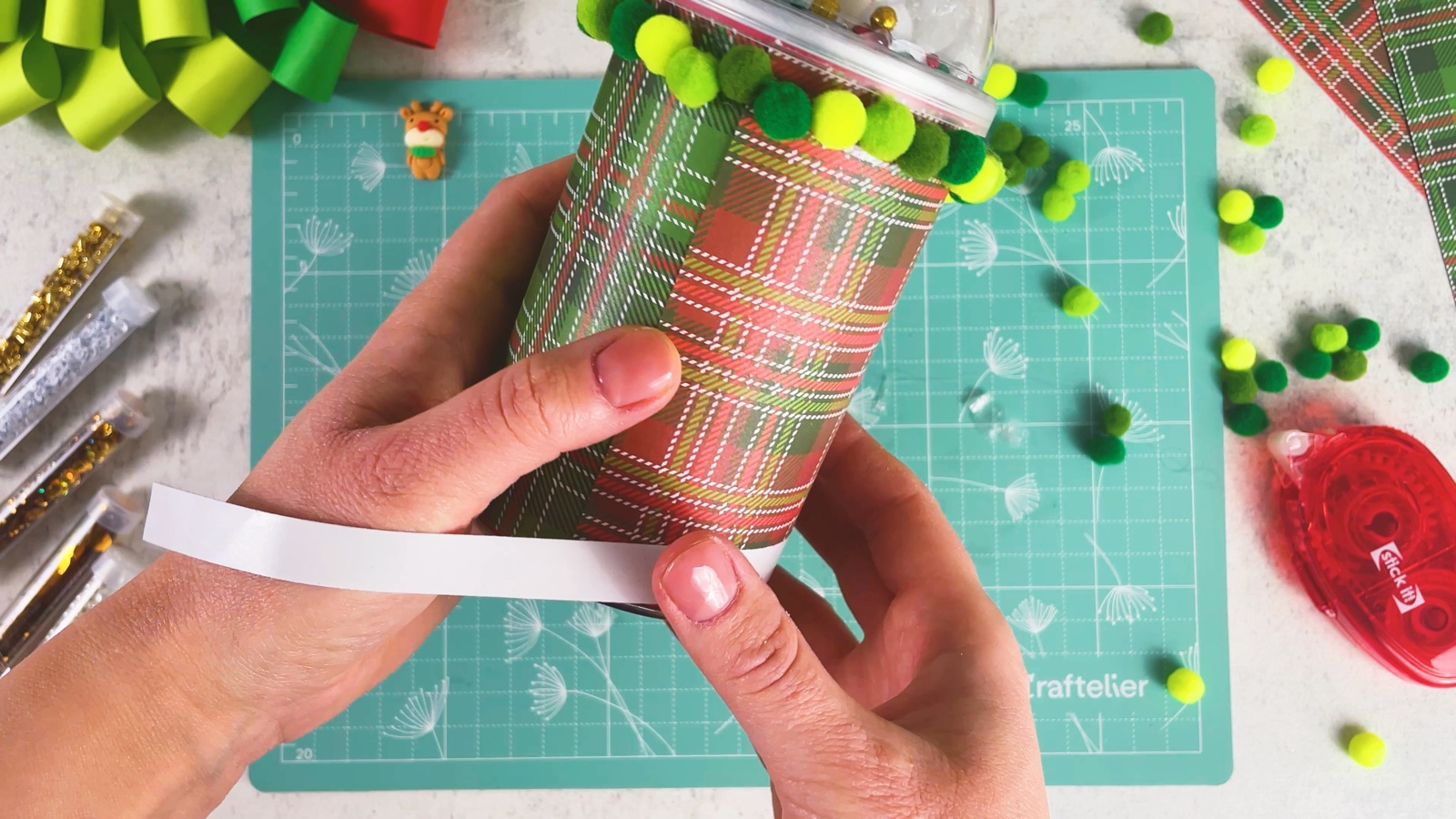 Wrapping a strip of double-sided tape around the bottom of the can