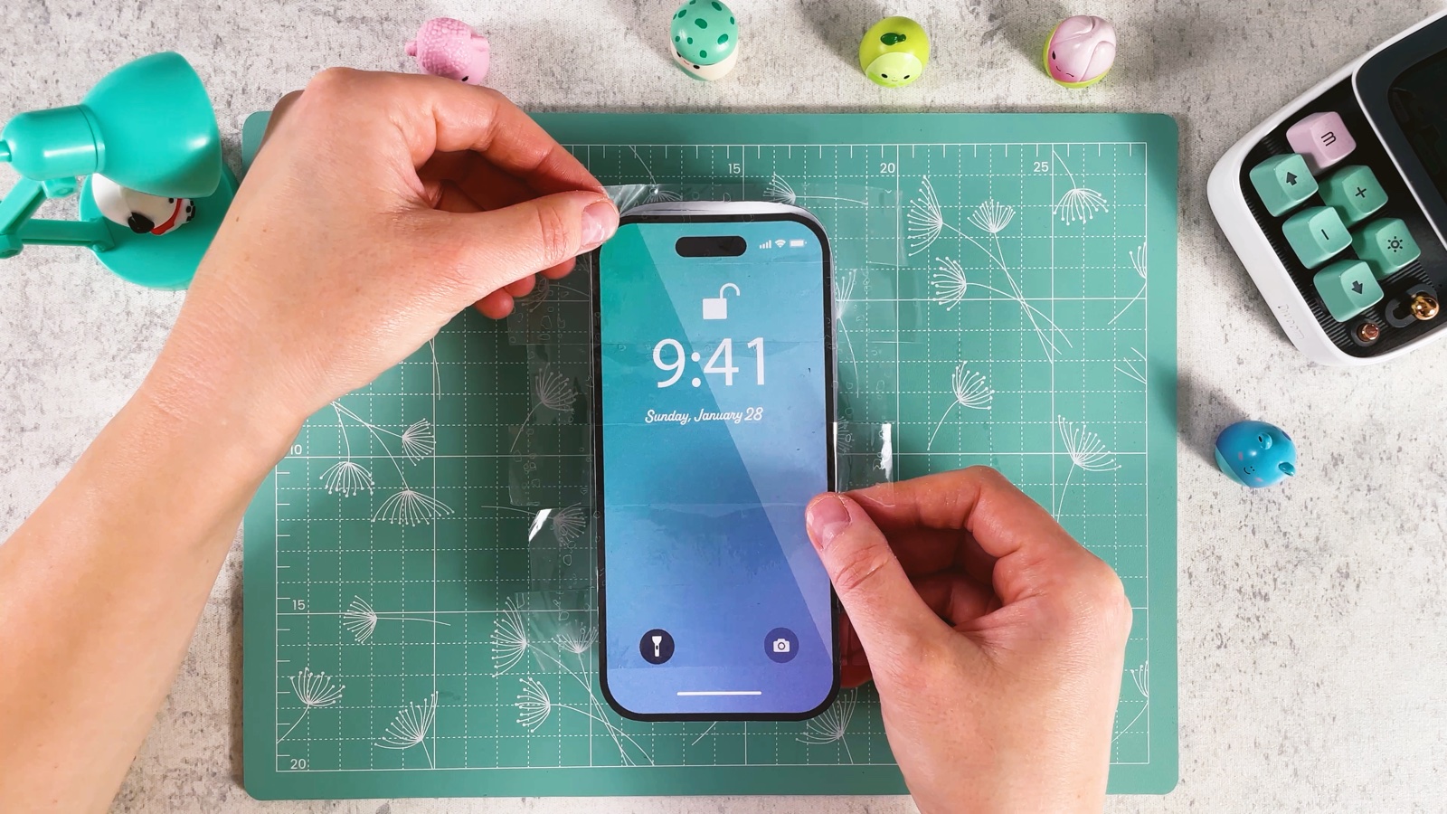 Trimming the tape around the top corner of the screen