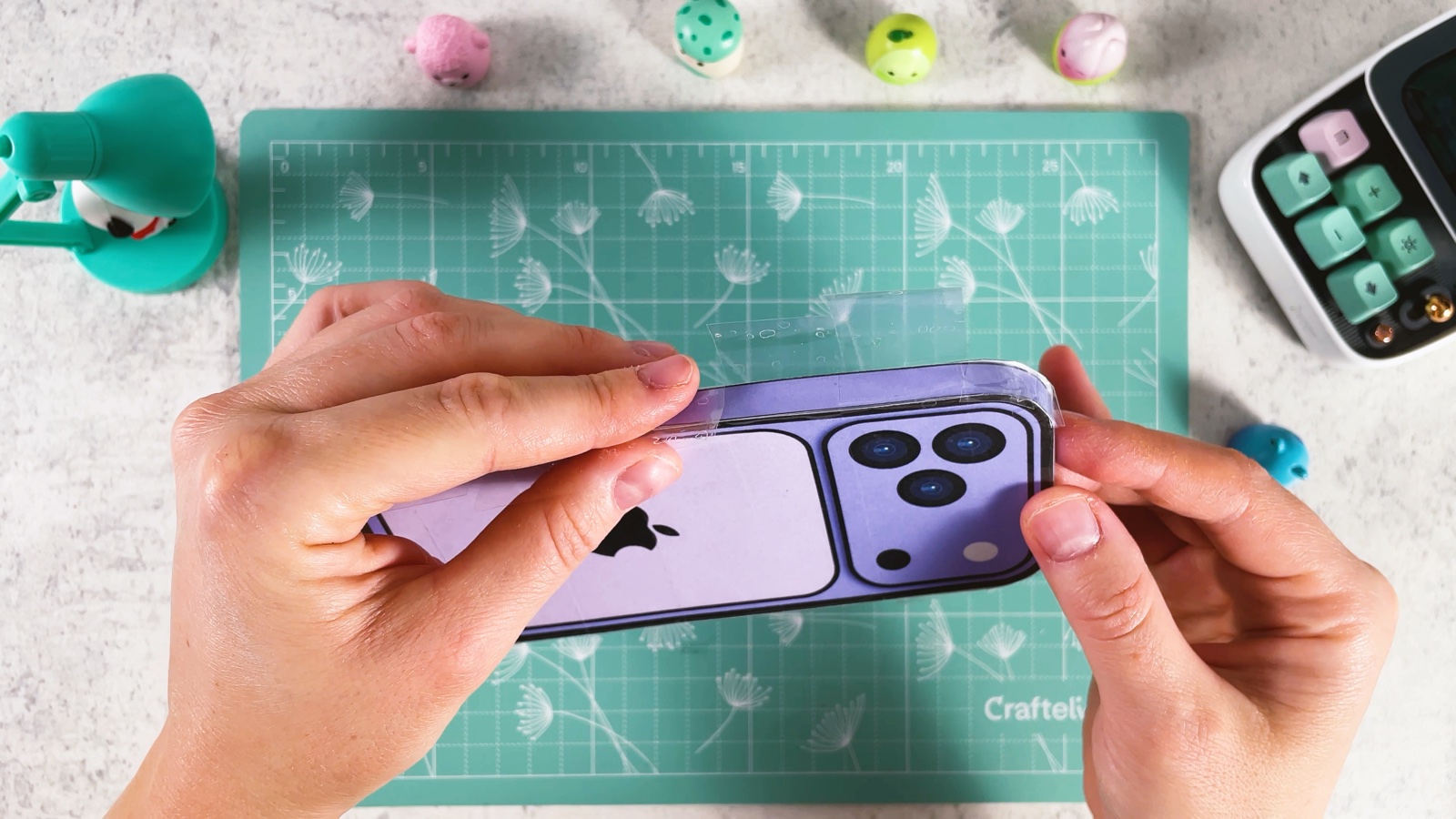 Taping the screen onto the side wall along the long edge of the phone