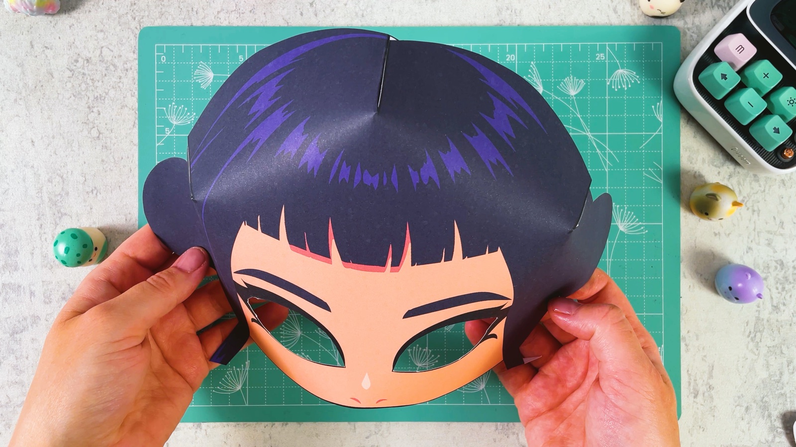 The mask with all three triangles glued, now curved like a real face