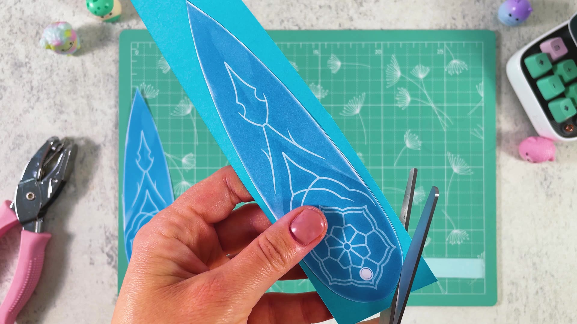 Cutting the blade out of the blue paper