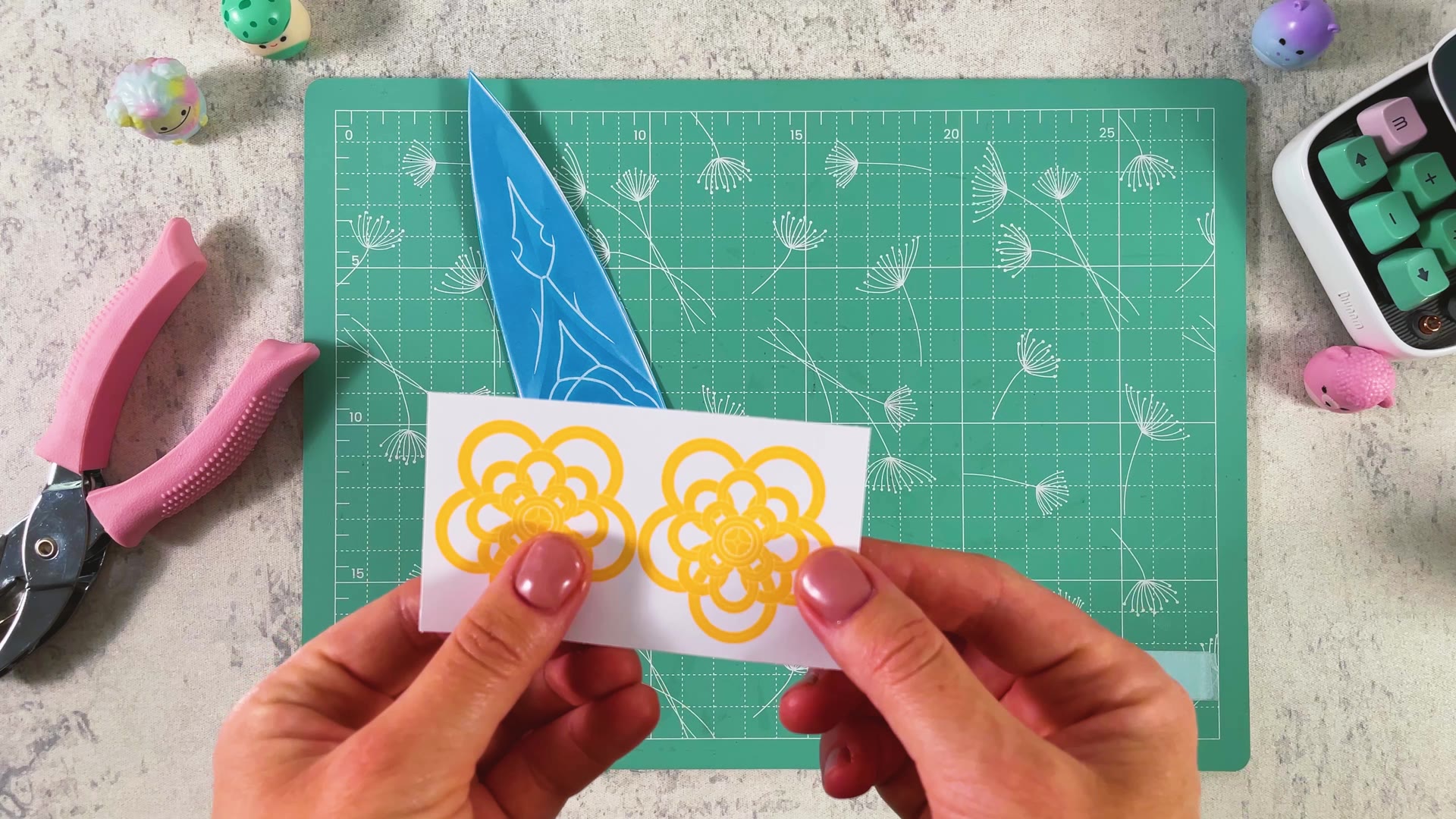 Cutting out two yellow flower charms