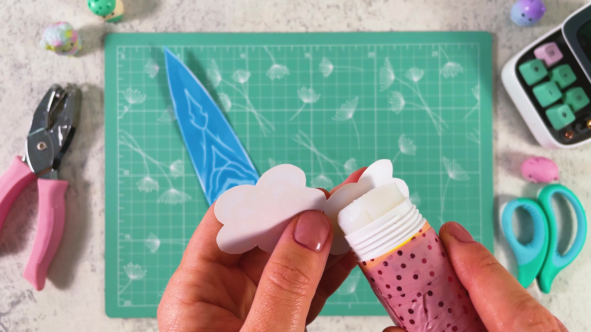 Gluing the two flowers together, white sides facing in