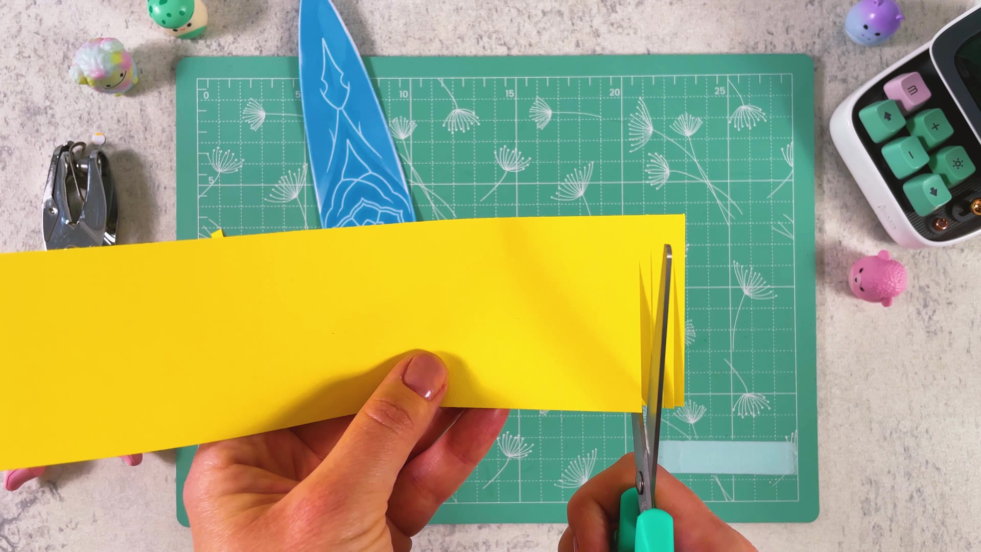 Cutting a fringe into a wide yellow panel