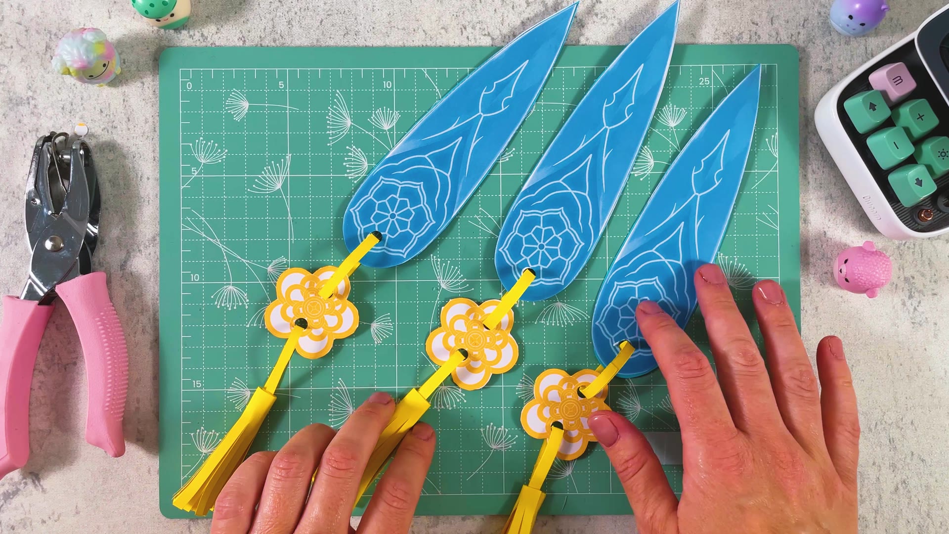 Three finished paper Spirit Blades laid out on a cutting mat